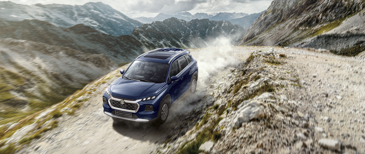 Suzuki Grand Vitara driving down a hill
